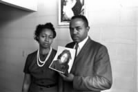 Mr. and Mrs. Chris McNair hold a picture of their daughter, Denise,.jpg