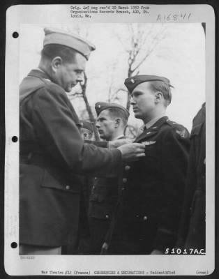 Thumbnail for Unidentified > Brig. General John P. Doyle presents an award to a member of the 320th Bomb Group during a ceremony at an airbase at Dijon, France. 1945.