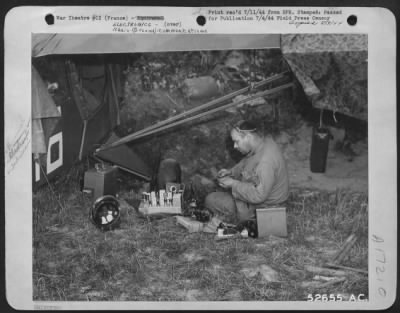 Thumbnail for Radio > Photographed by a 9th AF Combat Cameraman, Sgt. William N. Stehle of Perry, Mo., a radio repair man for the artillery, works on the radio from one of the small planes used in spotting targets and fire effectiveness for the ground forces.