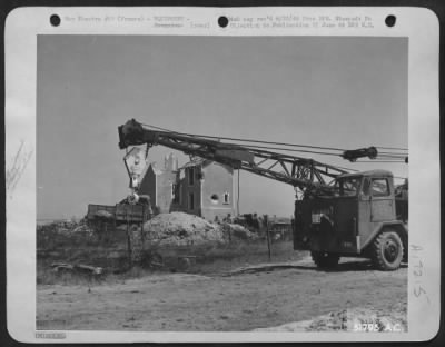 Thumbnail for General > Aviation engineers of the 9th Engineer Command can be seen here mobilizing some of their equipment on the other side of the Channel for work on one of the first emergency landing fields they laid down on the continent. The job of this specialized