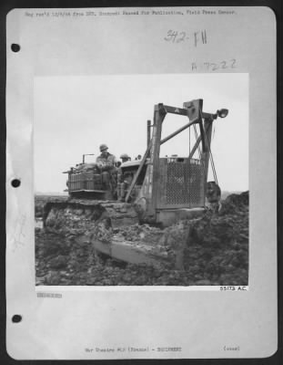 Thumbnail for General > Despite bitter weather and knee-deep mud, men and their equipment continue at work on the construction of front line airfields for 9th Air force fighter-bombers supporting the U.S. 1st-3rd-and 9th Armies in France. The photograph shows a