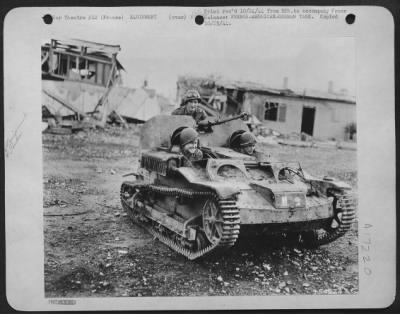 General > FRANCE-Men of a U.S. Army 9th Air force Service Command Ordnance Section built this baby tank from German, French, and American parts. The four-ton vehicle creeps behind hedgerows, dives into craters, or does an about-face with equal ease.