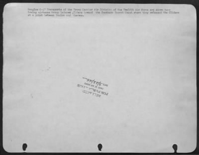 Thumbnail for General > Douglas C-47 Transports of the Troop Carrier Air Division of the Twelfth Air force are shown here towing airborne troop ladened gliders toward the Southern French Coast where they released the Gliders at a point between Toulon and Cannes.