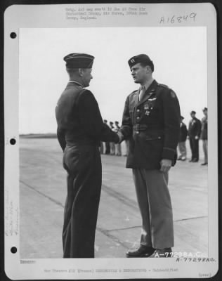 Unidentified > Major General Samuel E. Anderson Congratulates An Officer Of The 386Th Bomb Group After Presenting Him The Distinguished Flying Cross During A Ceremony At An Air Base Somewhere In Beaumont, France.  15 March 1945.