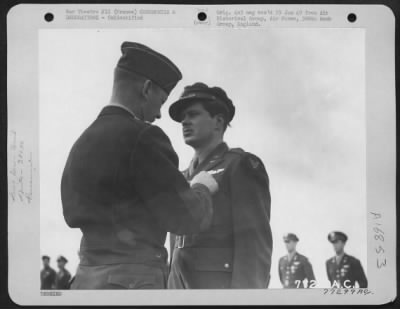 Unidentified > Major General Samuel E. Anderson Presents An Award To A Member The 386Th Bomb Group During A Ceremony At An Air Base In Beaumont, France.  15 March 1945.