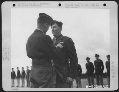 Unidentified > Major General Samuel E. Anderson Presents An Award To A Member The 386Th Bomb Group During A Ceremony At An Air Base In Beaumont, France.  15 March 1945.