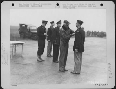 Unidentified > Major General Hoyt S. Vandenberg Presents An Award To A Member Of The 386Th Bomb Group During A Ceremony At An Air Base Somewhere In France.  23 October 1944.