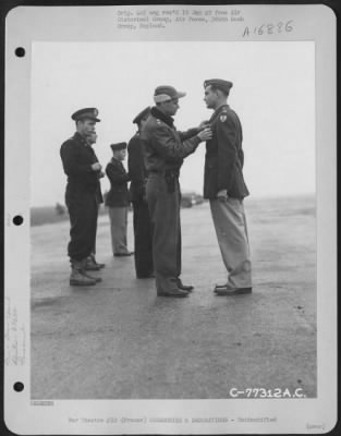 Unidentified > Major General Hoyt S. Vandenberg Presents An Award To A Member Of The 386Th Bomb Group During A Ceremony At An Air Base Somewhere In France.  23 October 1944.