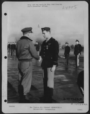 Unidentified > Major General Samuel E. Anderson Presents The Distinguished Flying Cross To An Officer Of The 410Th Bomb Group During A Ceremony At An Airbase Somewhere In France.