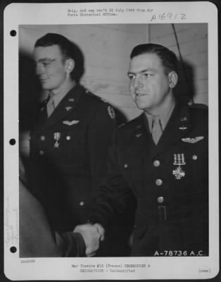 Unidentified > Major General Samuel E. Anderson Congratulates An Officer Of The 410Th Bomb Group After Presenting Him The Distinguished Flying Cross During A Ceremony At An Airbase Somewhere In France.