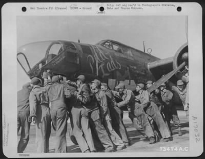 General > Members Of The Ground Crew Of The 9Th Bombardment Div. At Juvencourt Airfield, France, Push The Douglas A-20 'Pad Lads' Into Its Proper Parking Space After Returning From A Mission Over Enemy Territory.  11 April 1945.