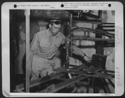 Consolidated > Sgt. Everett R. VanCleave, 2423 Spring St., Omaha, Nebraska, is turning on the power to put his newly invented aceteylene cutting machine into action.