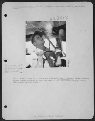 Consolidated > ITALY-Made of scrap iron, this wrench enables Sgt Jack C. Freeman, Celton Gardens, Laredo, Texas, to remove the rear sump plug of Pratt and Whitney R1830-43 engines with greater ease and speed.