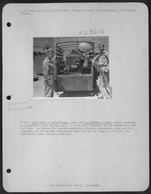 Thumbnail for Consolidated > ITALY-Sgt Roland B. Brouillette, left and Cpt Ernest U. Earn, right, standing by instrument field testing unit. C-10 of unit installed by Sgt. Brouillette and Cpl Earn. Instrument for checking manifold pressure, tachometer, fuel and oil pressure, and