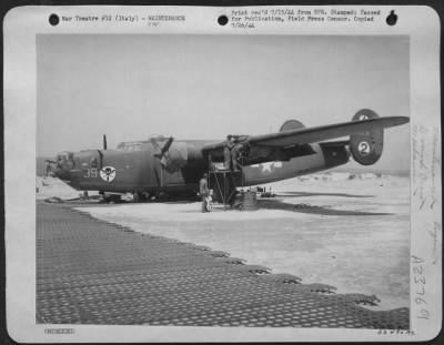 Thumbnail for Consolidated > Air Service Command Technicians have but to install the No. 1 engine and their job is done on this Consolidated B-24 Liberator that crash-landed recently on the shores of the Adriatic Sea in Italy after being severely damaged by enemy fire while on a