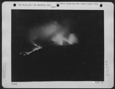 Thumbnail for Consolidated > This remarkable photograph of Mt. Vesuvius in eruption was taken by a Mediterranean Allied Air Forces photographer from the Naples-Pompeii road. The streams of molten, hot lava slowly cremated everything in its path forcing the residents of the towns