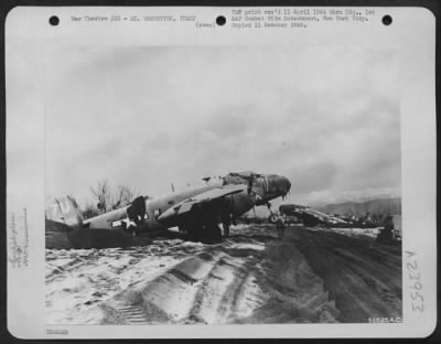 Thumbnail for Consolidated > These North American B-25s were bogged down in dunes of lava cinders, from the eruption of Mt. Vesuvius on 23 March 1944. The weight of cinders and ashes on the tail of the planes was so heavy that the nose was lifted off the ground.