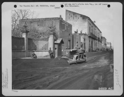 Thumbnail for Consolidated > Bull-dozers push the lava cinders from the streets of Cercola, Italy. The "black snowfall" was caused by the eruption of Mt. Vesuvius. March 1944.