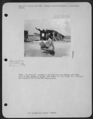 Consolidated > ITALY-The National pastime is the international pastime, and shown above is Cpl. Booker T. Little, 3211 Lawton St., St. Louis, Mo., catching the tosses of one of his ball playing pals.