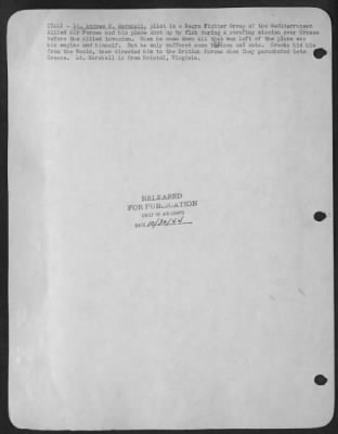 Consolidated > ITALY-Lt. Andrew D. Marshall, pilot in a Negro Fighter Group of the Mediterranean Allied Air Forces had his plane shot up by flak during a strafing mission over Greece before the Allied invasion. When he came down all that was left of the plane was