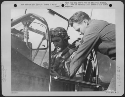 Thumbnail for Consolidated > Lt. Walter L. Gibson, North American A-36 Pilot Based In Italy, Gets Buttoned Up By The Assistant Crew Chief, Sgt. Paul S. Goldman, Just Before Taking Off On A Mission Above Rome.