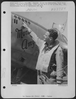 Thumbnail for Consolidated > 2Nd Lt. Herbert B. Hatch Of Stockton, Calif. A Lockheed P-38 Lightning Fighter Pilot Of The Mediterranean Allied Afs In Italy, Proudly Points To The 5 Swastikas On The Nose Of His Plane, That Proclaim His Victory Over 5 Hun Aircraft That He Shot Down In A