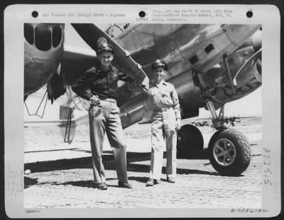 Consolidated > Two Pilots Of The 94Th Fighter Squadron, 1St Fighter Group, Stand Beside A Lockheed P-38 Lightning At An Air Base Somewhere In Italy.  21 September 1945.