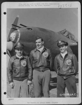 Thumbnail for Consolidated > Three Pilots Of The 94Th Fighter Squadron, 1St Fighter Group, Stand Beside A Lockheed P-38 Lightning At An Air Base Somewhere In Italy.