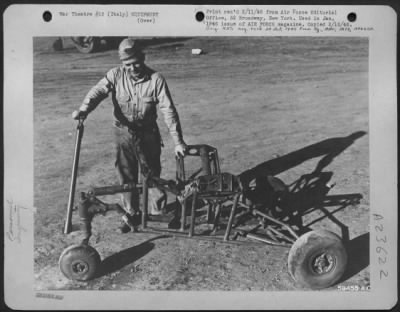 Thumbnail for Consolidated > As A Means Of Saving Full Jettisonable Tanks From Damage On Removal, S/Sgt. Granville Fannion, Paintsville, Ky, Built This Hydraulically Operated Drop Tank Remover From A Spitfire, A P-40 And Salvage Parts At His 15Th Af Base In Italy.