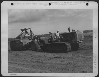 Thumbnail for Consolidated > Even The Fighter Fields Get A Face Lifting In Readiness For Old Man Winter.  Here, A Huge Cat And Scraper Of A Fighter Group Of Mediterranean Allied Air Forces Operated By T/4 Leo H. Lennon, 28 Of Gladwin, Michigan, Resurfaces An Air Strip Somewhere In It