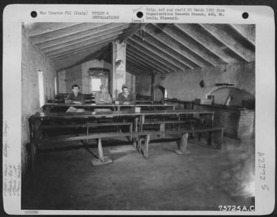 Thumbnail for Consolidated > Three Men Of The 94Th Fighter Squadron, 1St Fighter Group, Seated In The Mess Hall At Their Base Somewhere In Italy.