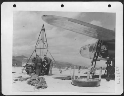 Consolidated > Busy Ground Crewmen Will Have A New Engine Installed In Reocrd Time And The Sturdy B-25 Mitchell Will Be Ready Once More To Attack The Heavily Defended Brenner Pass Line.  12Th Aaf.