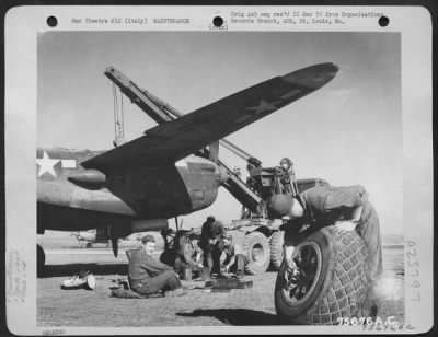 Thumbnail for Consolidated > Maintenance Men Of The 94Th Fighter Squadron, 1St Fighter Group Work On A Lockheed P-38 Lightning At An Airfield Somewhere In Italy.