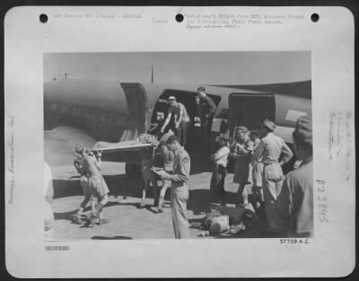 Thumbnail for Consolidated > Wounded British And Indian Troops Being Carried On To A Dakota Aircraft At A Forward Airfield In Italy, For Evacuation To Base Hospitals.  Raf And British Army Medical Orderlies Are Seen Helping The Wounded Onto The Plane.