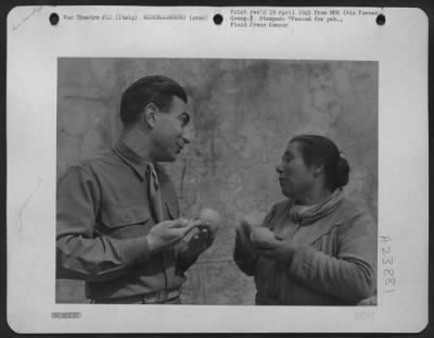 Thumbnail for Consolidated > Sgt. Eddie Cope Of Austin, Texas Tries Out Sign Language On An Italian Fruit Peddler.  He Buys An Orange - But It Costs Him Double!  Italy.