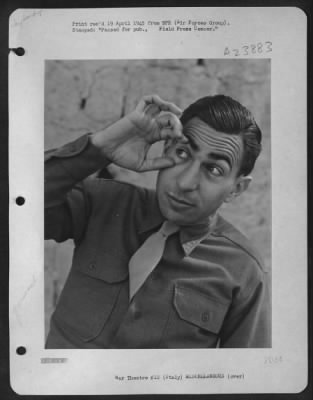 Thumbnail for Consolidated > Sgt. Eddie Cope Of Austin Texas Illustrates The Sign Language Enabling American G.I.'S In Italy To Carry On Long And Involved Conversation With The Local Talent.  'Open Your Eyes' - Thumb And Forefinger Pry Open The Right Eye In A Gesture Of Mild Sarcasm.