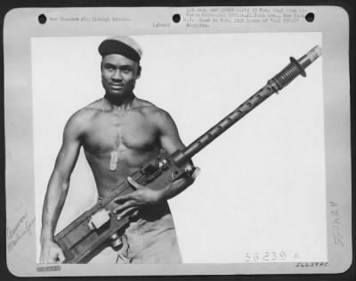 Thumbnail for Consolidated > Armorer Removes Machine Gun From North American P-51 Mustang For Routine Inspection.  Italy