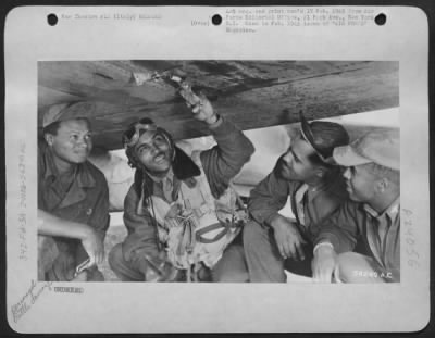 Thumbnail for Consolidated > Capt. Armour G. Mcdaniels, Squadron Operations Officer Points Out A Cannon Hole.  Italy.