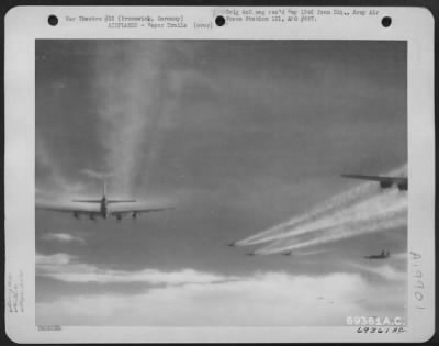 Thumbnail for Consolidated > Boeing B-17 Flying Fortresses Of The 91St Bomb Group Leave Trails Of Vapor Behind As They Wing Their Way Toward The Target - An Enemy Installation In Brunswick, Germany.  30 Jan 1944.