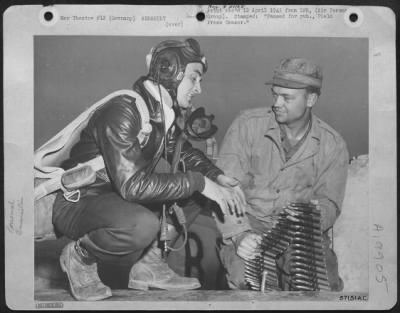 Thumbnail for Consolidated > 2Nd Lt. Merle D. Richey Of Dayton Ohio And Rockway Park, Nj, Supervises His Armorer, Cpl. Wallace S. Barbee, Calhoun City, Ms, During Loading Of 50 Calibre Ammunition In His Republic P-47 Thunderbolt.  A Veteran Of 46 Combat Missions, Lt. Richey Destroyed