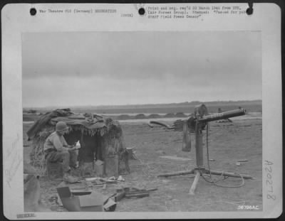 Thumbnail for Consolidated > T/5 Philip Gilleo of Mountville, N.Y., an anti-aircraft gunner guarding one of the 9th AF Airstrips in Germany, catches up on his reading as he uses a Jerrican for a seat in front of his "straw" shelter.