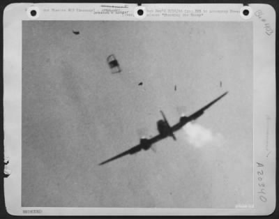 Thumbnail for Consolidated > With bits of wreckage hurtling through the air above it, this twin-engined Nazi plane, fire pouring from its starboard motor, was downed for the count by Lt. Richard A. Stearns on 5 Nov 1943.