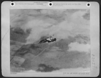 Consolidated > Burning Liberator Disintergrates in Air: A victim of a direct hit by flak, these two photos graphically portray the final plunge of a B-24 Liberator of the U.S. 8th AF during the March 20th attack on Frankfurt. One of the six bombers which failed to