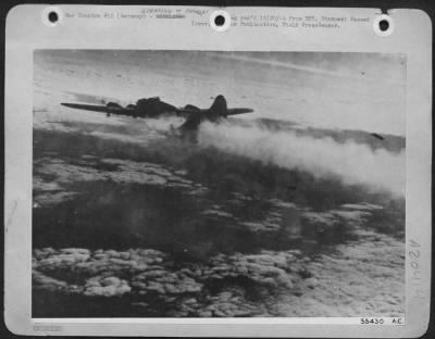 Thumbnail for Consolidated > The dangers of close formation flying sometime take their toll of U.S. Army 8th Air Force heavy bombers as witnessed by this collision when Boeing B-17 Flying Fortresses attacked Stuttgart, Germany, 12/9/44. In this photo a damaged Fortress limps