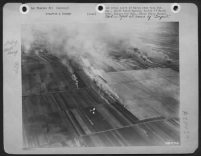 Thumbnail for Consolidated > 4th Fighter Group attacking German aircraft on airdrome 30 miles west of Leipzig, Germany, on February 27, 1945. The Group, commanded by Col. Everett W. Stewart, 300 Rogers Ave., Abilene, Kansas, destroyed 41 aircraft, some of which are shown burning