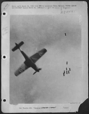 Thumbnail for Consolidated > BOMBS ALMOST HIT FIGHTER--A surprise objective in the form of an FW-190 German single engine fighter looms beneath bombs dropped by a 9th Bombardment Division B-26 Marauder. It was a near miss for the bombs. This remarkable photograph, taken