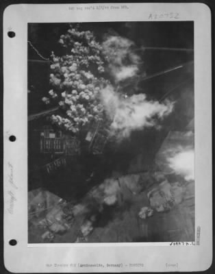 Thumbnail for Consolidated > White buds of destruction-Like white budding flower blossoms, the bomb bursts in a compact cluster at the height of the attack on the Junkers aircraft engine plant at Arnimswalde, a few miles east of Stettin, during the April 11th 1944 assault by