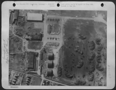Consolidated > BEFORE . . AT AUGSBURG: Reconnaissance photo of important Messerschmitt works at Augsburg before attack on 13 April by 8th AAF heavy bombers. The three round-roof hangars were destroyed; direct hits were made on large assembly shops, machine