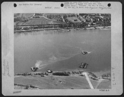 Thumbnail for Consolidated > Germany - Protected By A Cover Of Figher-Bombers Provided By Major General O.P. Weyland'S Xix Tactical Air Command, Us 3Rd Army Troops Established A Bridgehead On The East Side (Foreground) Of The Rhine.  Tanks Are Being Ferried On Pontoon Rafts.  One Of