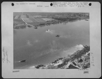 Thumbnail for Consolidated > Germany - As Two 3Rd Army Tanks Are Ferried Across The Rhine River, Infantrymen Deploy Along The Road At Upper Left.  At The Time This Photo Was Taken By An Xix Tactical Air Command Camerman, The Germans Still Held The Territory In The Distance.